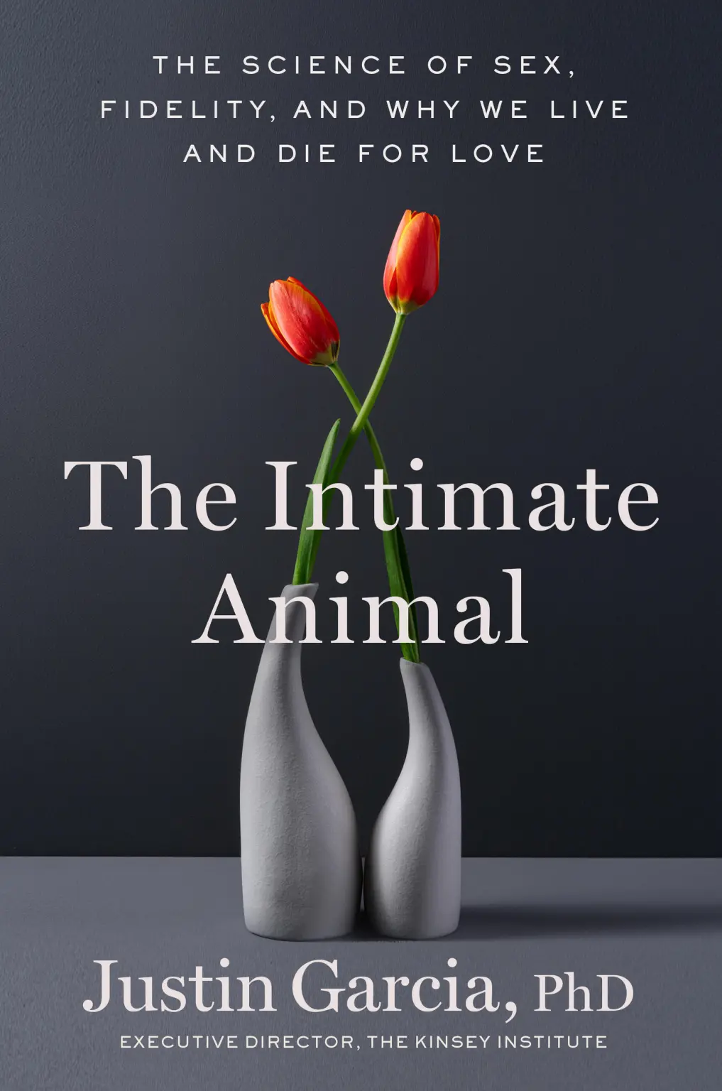 Book cover with two tulips with stems crossing placed in separate vases beside each